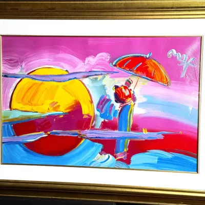 Peter Max mixed media painting featuring his signature umbrella man motif against a vibrant sunset, presented in a gold-finished frame...