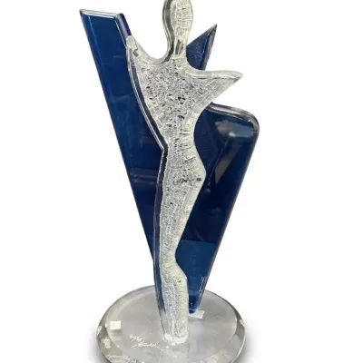 Lucite and glass abstract sculpture by Shlomi Haziza, featuring a textured clear figure set against a deep blue geometric background on a...