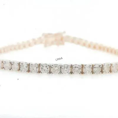 Classic diamond tennis bracelet featuring a continuous line of round-cut diamonds set in rose gold.