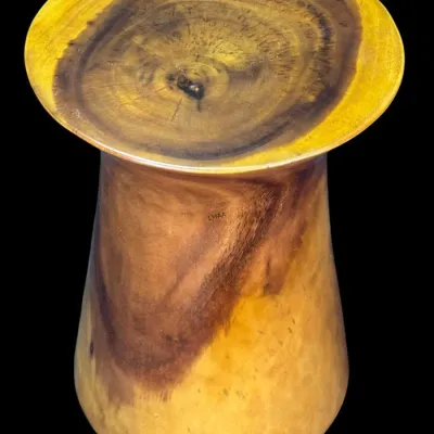 Hand-carved solid wood pedestal side table or stool, showcasing natural wood grain and growth rings with a polished finish.
