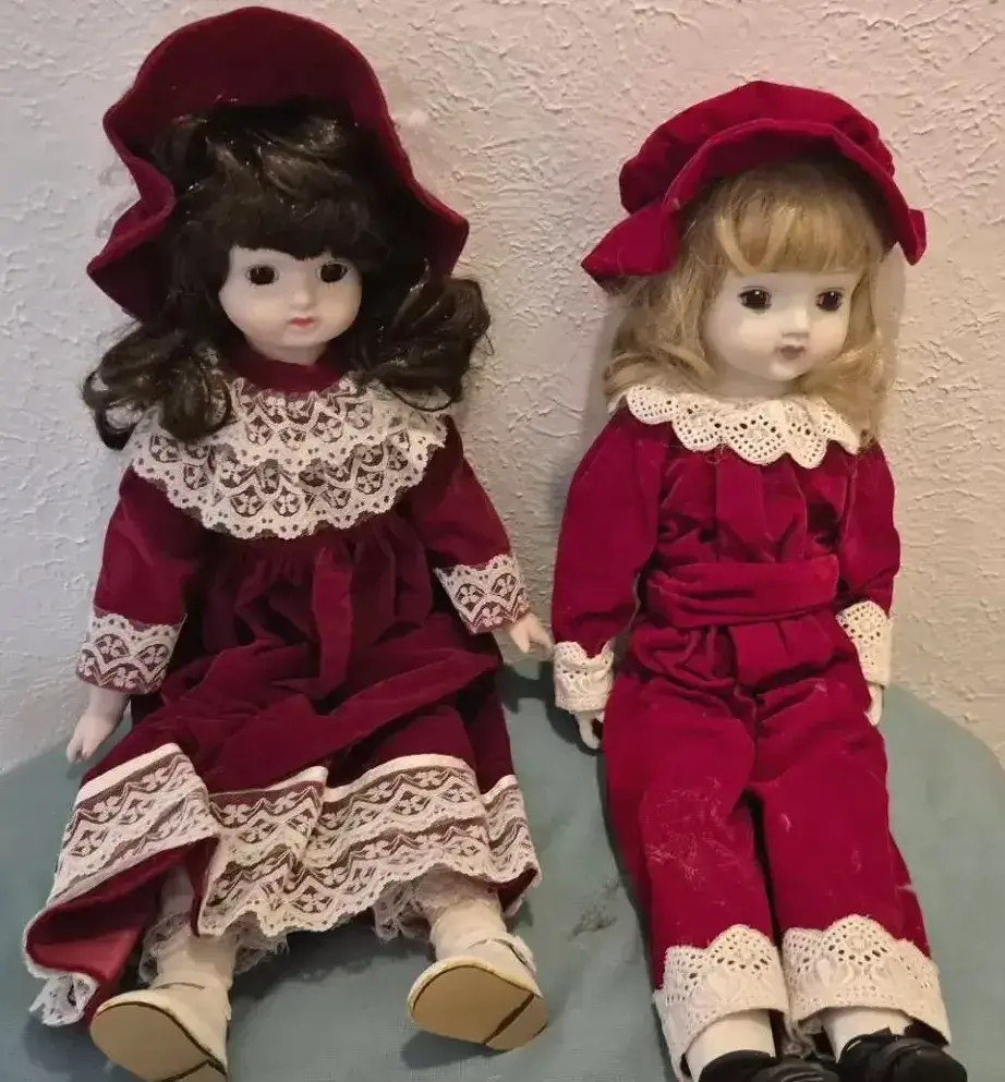 Pair Of Vintage Porcelain Dolls Dressed In Matching Red Velvet With Bonnets
