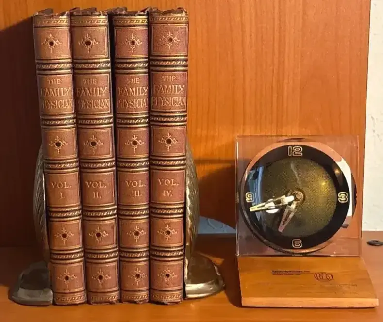 Brass Bookends Shaped Like Seashells Desk Clock And The Family Physician Books