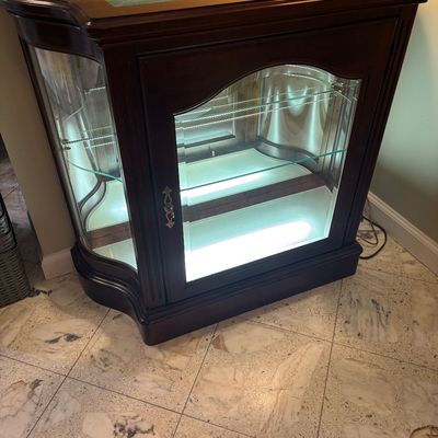 Mahogany low lighted curio cabinet 
