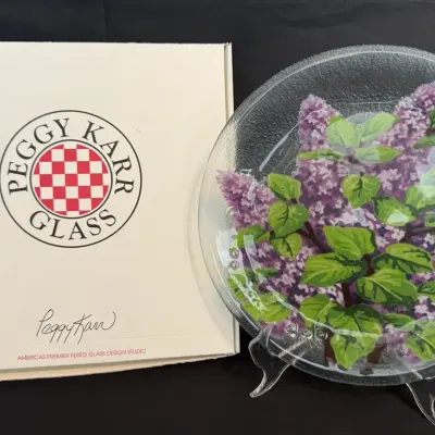 LCJ001 - Peggy Karr Fused Glass Lilac Floral 11” Plate, Signed with Original Box.
