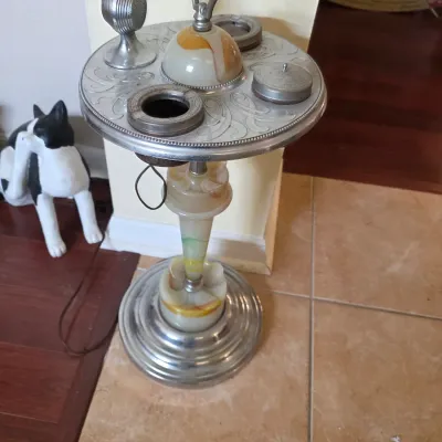 Vintage Art Deco smoking stand featuring a chrome and slag glass pedestal base, an engraved metal tray top, integrated ashtrays, a...
