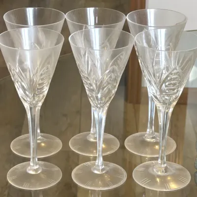 Set of six vintage crystal wine goblets featuring an elegant cut-glass leaf pattern and frosted details on the base.