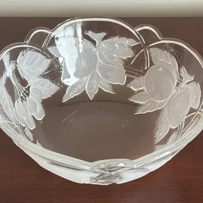 Mikasa 'Park Lane' frosted and clear crystal bowl featuring embossed fruit designs and a scalloped rim.