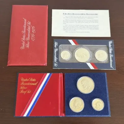 Sale Photo Thumbnail #305: United States Bicentennial Silver Uncirculated Set (1776-1976) and United States Bicentennial Silver Proof Set, both complete with original packaging and informational inserts.