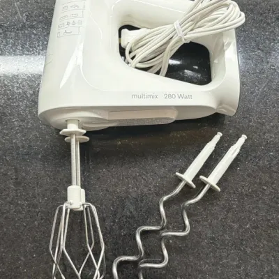 Braun Multimix 280 Watt hand mixer in white, complete with one wire beater attachment and a pair of dough hooks.