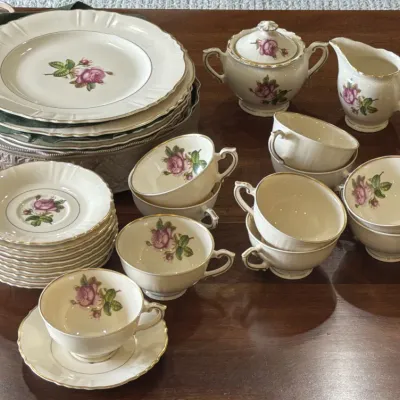 Vintage Rosenthal porcelain dinnerware set in the 'Moss Rose' pattern, featuring a delicate pink rose motif with gold trim,...