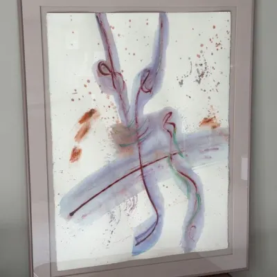 Sale Photo Thumbnail #109: Framed abstract mixed media painting on paper, featuring expressive brushstrokes and splatters in shades of purple, red, and green, presented in a dusty rose frame.