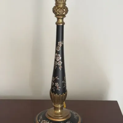 Vintage Stiffel-style table lamp featuring a black body adorned with delicate floral mother-of-pearl inlay and brass accents.