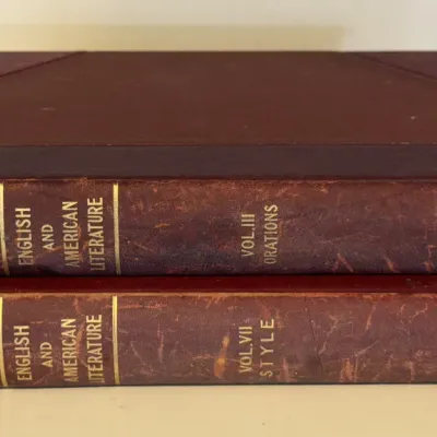 Two antique volumes of "English and American Literature" published by F.E. Reeve & Co., featuring worn leather spines with...