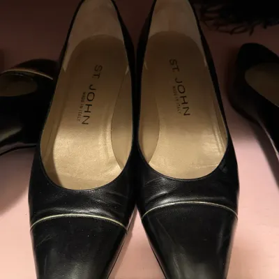 Pair of St. John black leather pumps with a square toe and gold-tone piping detail, made in Italy.