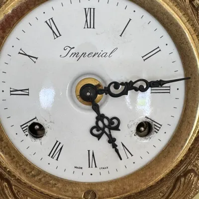 Vintage Imperial clock face made in Italy, featuring a white dial with black Roman numerals, ornate black hands, and a decorative...