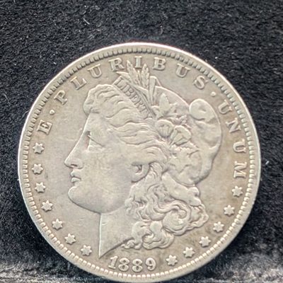 Sale Photo Thumbnail #99: 1889-O Morgan 90% Silver Dollar