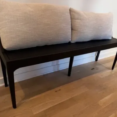 Black wood bench with throw pillows