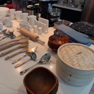 Kitchen lot: bamboo steamer, wood bowls, utensils, bakeware