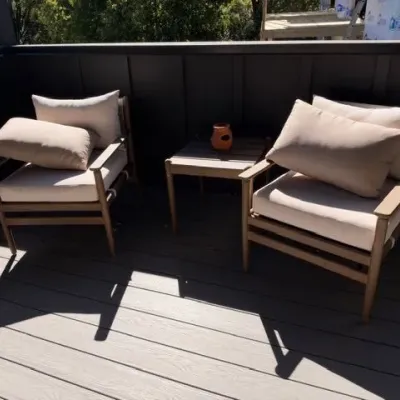 Pair of wood frame outdoor lounge chairs with side table