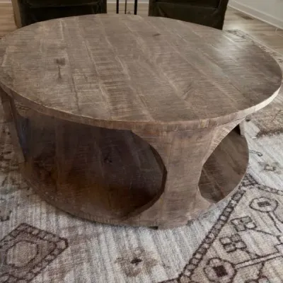 Round carved wood drum coffee table