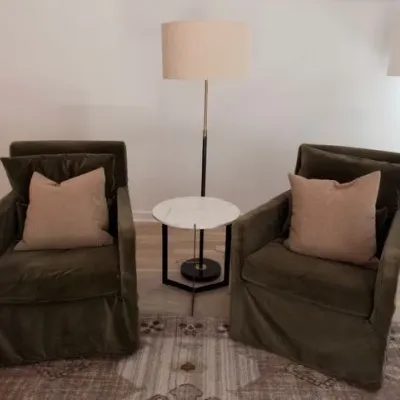 Pair of Atelier olive green velvet slipcovered armchairs