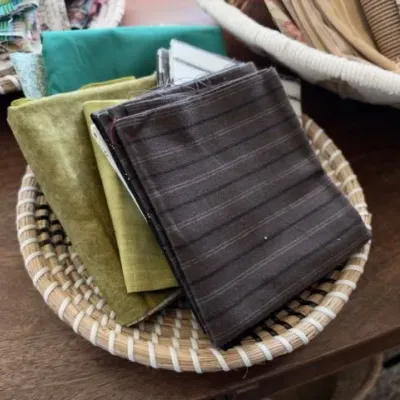 Quilting fabric lot in woven basket