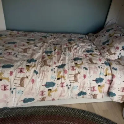 Kids bed with woodland animal print bedding