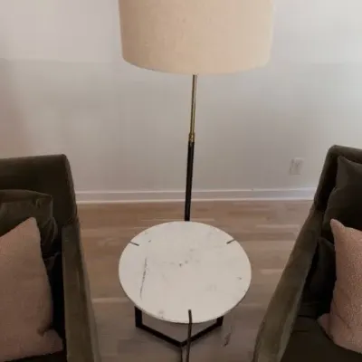 Marble-top side table and West Elm telescoping floor lamp