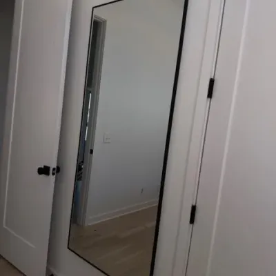 Black metal frame full-length floor mirror