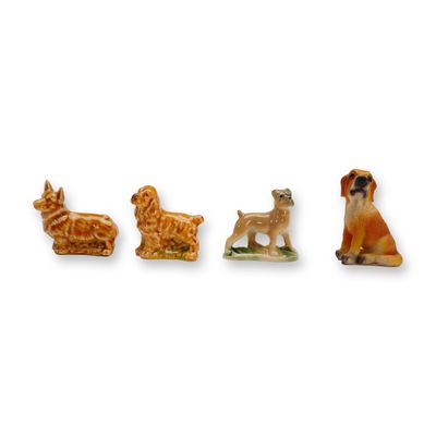 Sale Photo Thumbnail #272: A Collection of 4 Miniature Ceramic and Resin Dog Figurines
