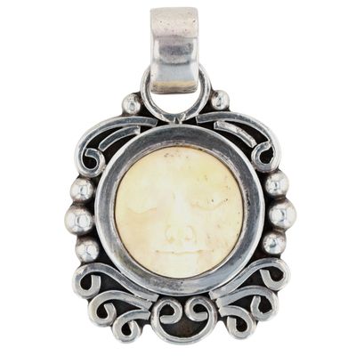 Sale Photo Thumbnail #572: Sterling Silver Carved Bone Moon Face Pendant