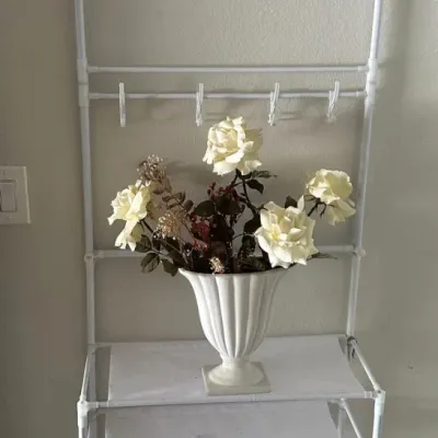 White Metal Shelf with Floral Arrangement