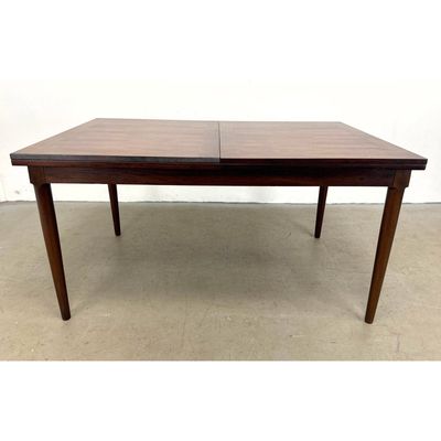 Danish Modern Rosewood Extendable Dining Table with flip open extensions.