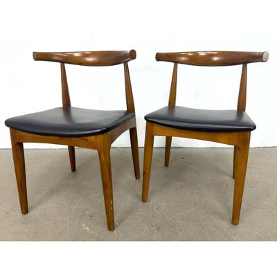 Pair of Mid-Century Modern Teak Finished Hardwood Dining Side Chairs with Black Vinyl Upholstery. We