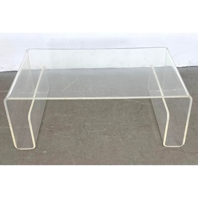 Modernist Acrylic Waterfall Coffee Table. Storage end pockets. Clear acrylic construction.