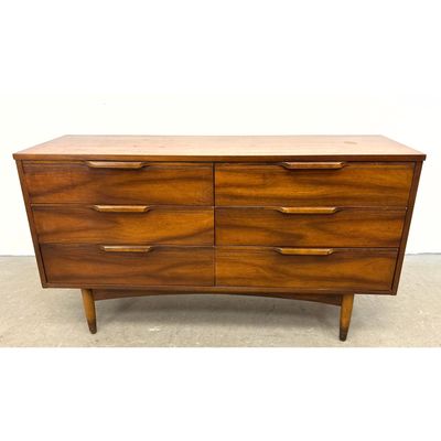 Mid-Century Modern 6 drawer Walnut Dresser with sculpted wood pulls and tapered legs.