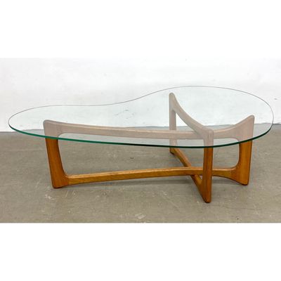 Contemporary wood and Glass Coffee Table After a Pearsall Design.