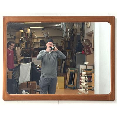 Large Mid Century Modern Danish teak wall mirror with sculpted frame and rounded corners