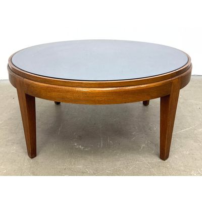 Art Deco Style Mid-century modern circular wood coffee table with inset tinted glass top and tapered