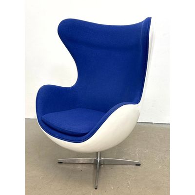 Contemporary Modern Swivel Lounge Egg Chair. Swivel egg chair with white fiberglass shell and blue w