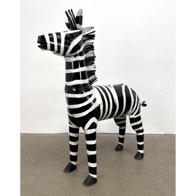 Mexican hand welded sheet metal folk art zebra sculpture with hand painted black and white stripes.