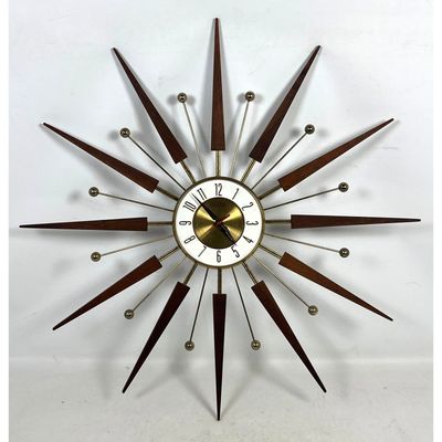ELGIN Mid Century Modern Starburst Wall Clock. Wood and Brass Toned Rays. Battery OP. Marked ELGIN.