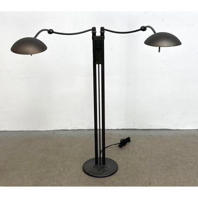 Postmodern style adjustable 2 light floor lamp in patinated brass with dual arcing arms and dome sha