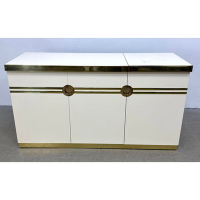 Pierre Cardin Modernist white laminate and brass trim dry bar credenza with flip top and removable i