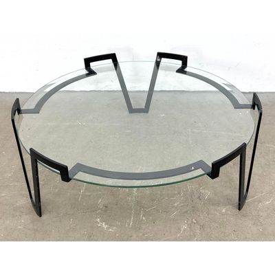 After Jean Royere Gilt Iron and Glass Cocktail Table. Round glass top rests in stylish 3 leg frame w