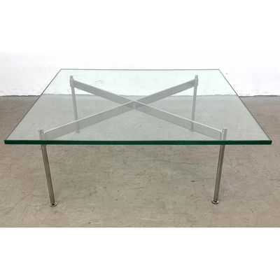 Modernist Glass Top Coffee Table. Flat Chrome X Base Frame with Round Rod Legs. .