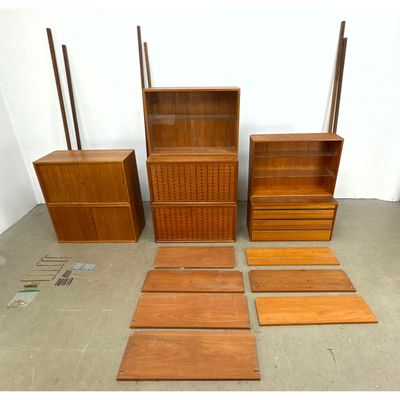 Danish Modern Cado Wall Shelf Unit. 6 uprights. 2 drop desks. 2 wood sliding cabinets. 2 glass slidi
