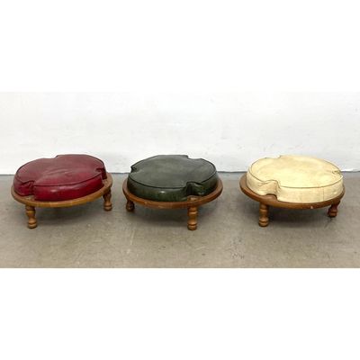 3pc set of mid century modern round stacking footstools with multi color vinyl upholstery and turned