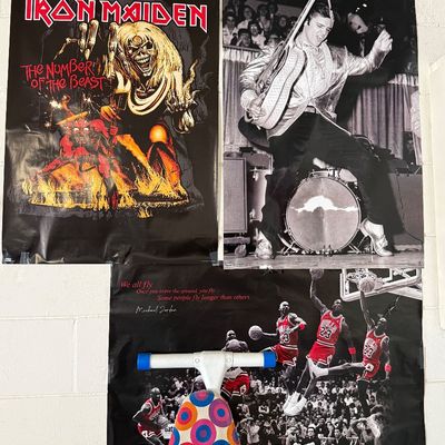 Collection of vintage wall posters featuring Iron Maiden's "The Number of the Beast," Elvis Presley performing live, and a...