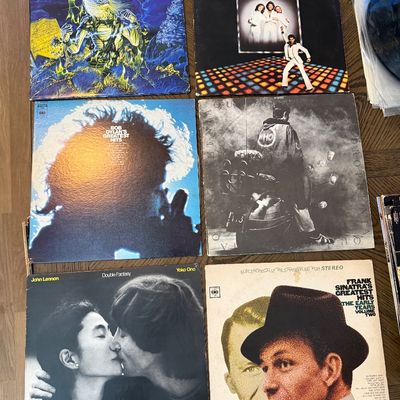 Collection of classic vinyl LP records, including Iron Maiden's "Live After Death," Bob Dylan's "Greatest...